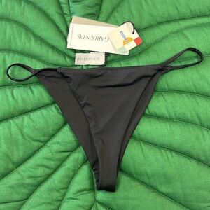Brand new, NWT Dos Gardenias string bikini bottom. Color: Black. Size 4